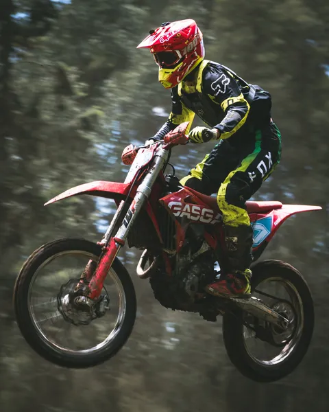 Motocross rider suspended above the track