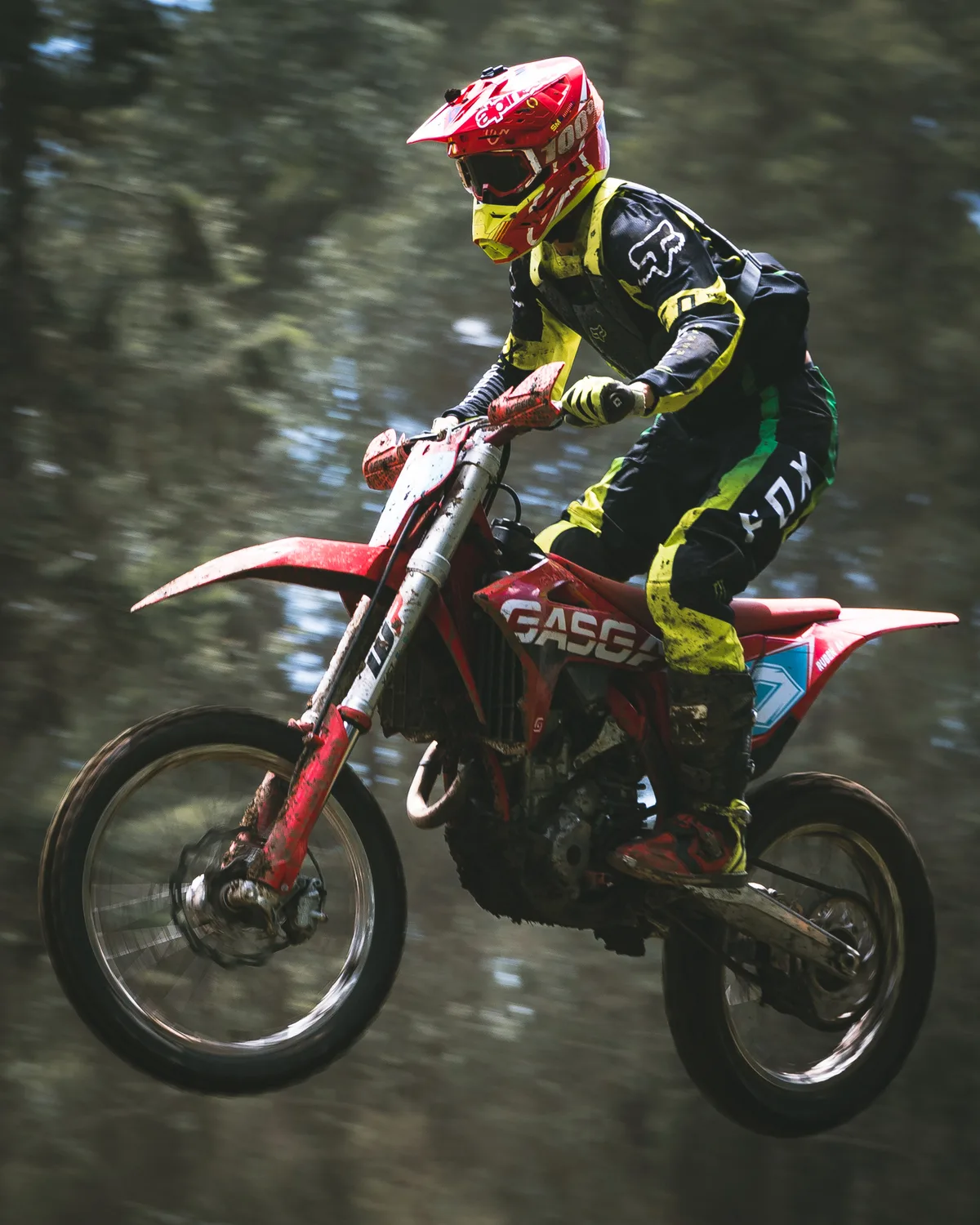 Suspended. Dust, flight, and the compressed rhythm of a district motocross championship.
