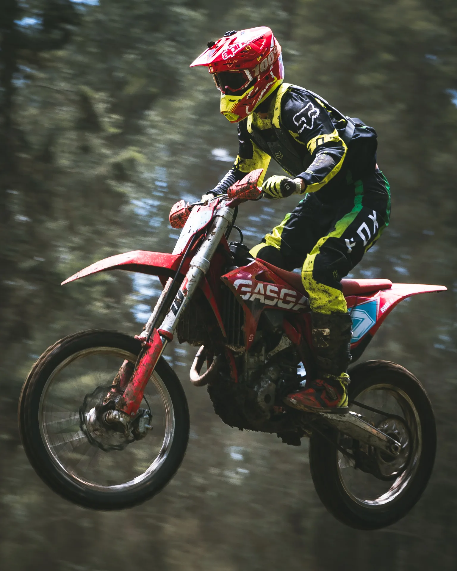 Suspended. Dust, flight, and the compressed rhythm of a district motocross championship.