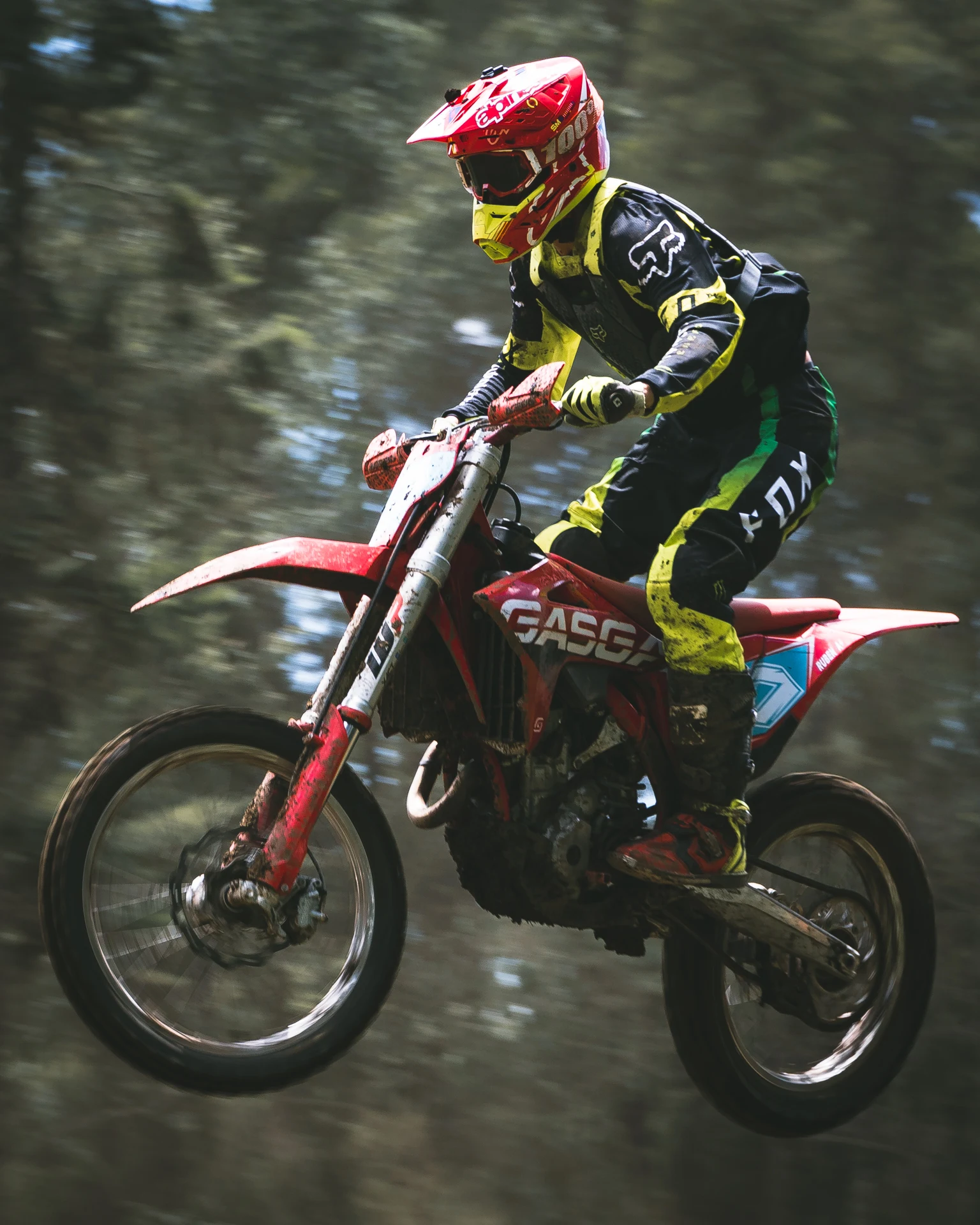 Suspended. Dust, flight, and the compressed rhythm of a district motocross championship.